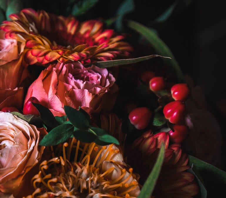 Rich red and orange colored DIY wedding flowers, perfect for fall and autumn bouquets and arrangements.